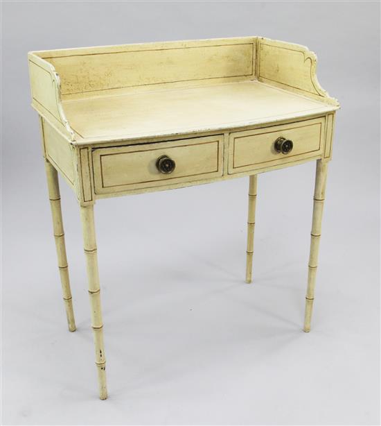 A Regency cream painted bowfront washstand, W.2ft 7in.